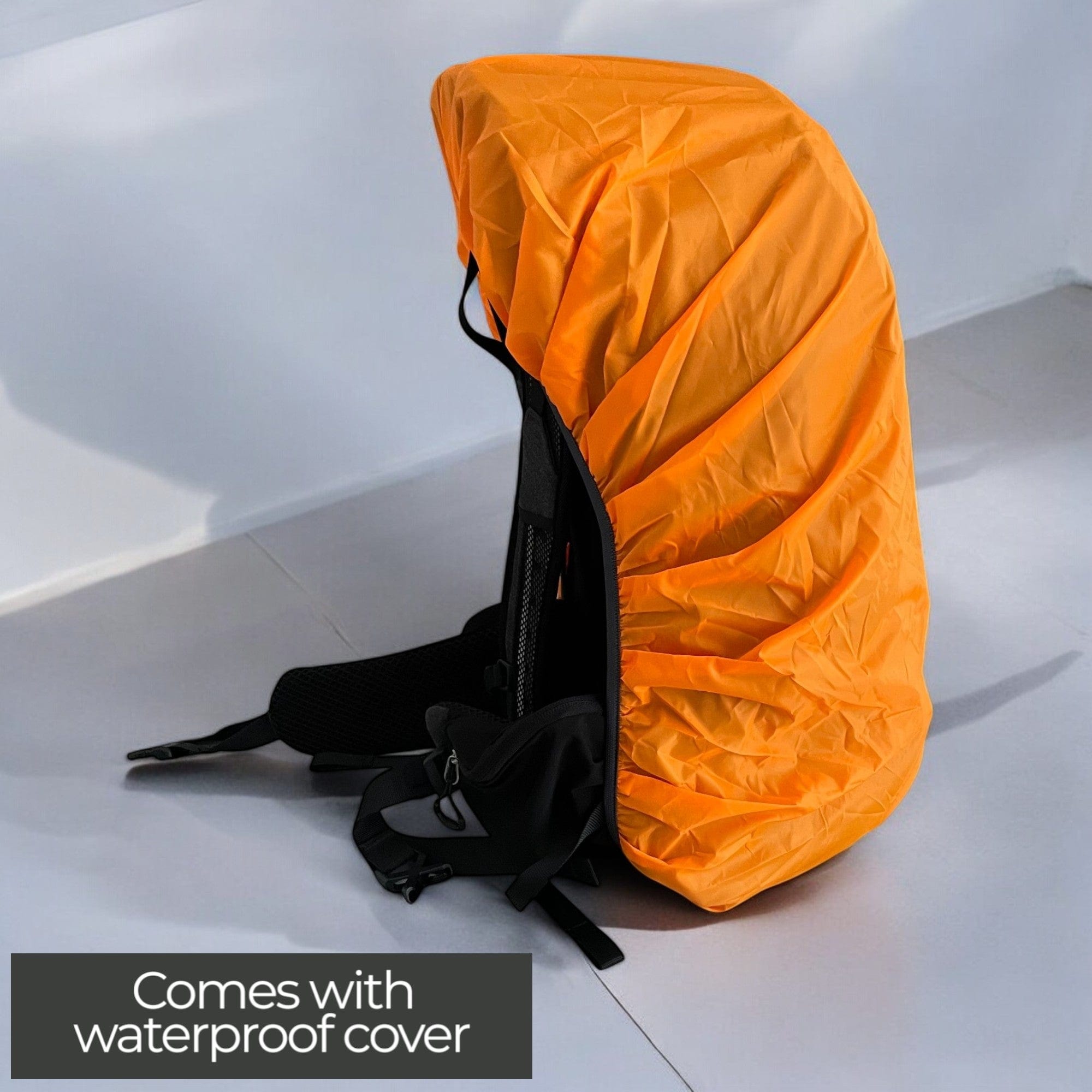 Trailblazer Backpack’s water-proof cover protecting gear from rain, perfect for outdoor adventures.